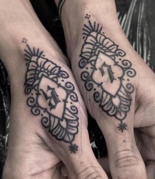 Blackwork ornamental initial tattoo by @sharitattoos