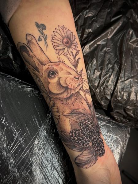 Illustrative rabbit with flowers tattoo by @sharneeoliver_tattoo