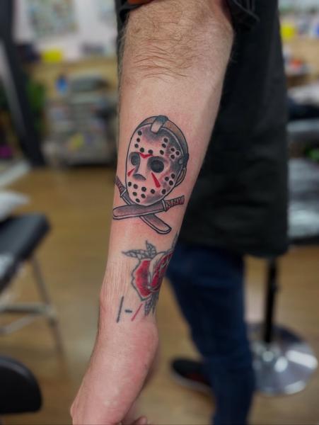 Traditional jason mask machetes tattoo by @shrddr_tattoo