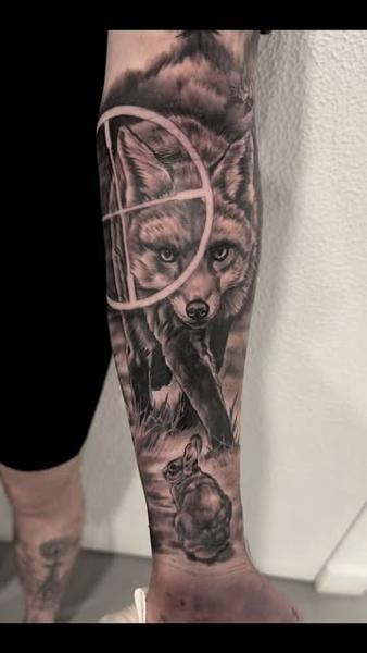 Realism fox rabbit target tattoo by @shayne.r.tattoos