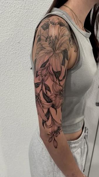 Illustrative lily flowers tattoo by @shayne.r.tattoos