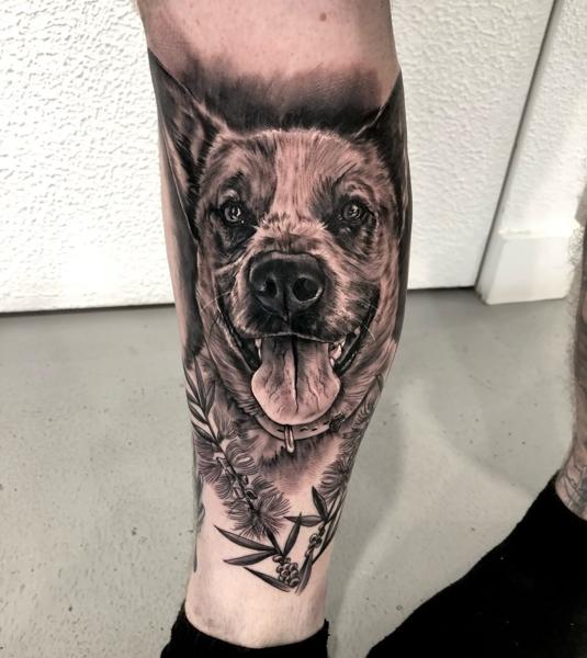 Realism floral dog portrait tattoo by @shayne.r.tattoos