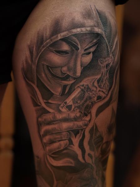 Realism anonymous mask card tattoo by @sherree_lionheart_tattoos