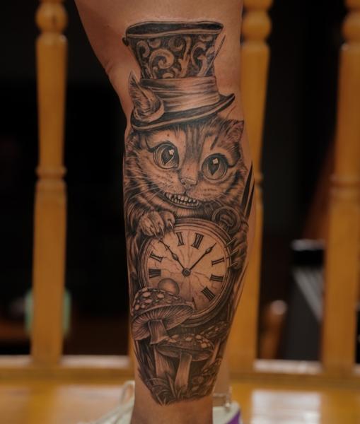 Illustrative realism cheshire cat clock tattoo by @sherree_lionheart_tattoos