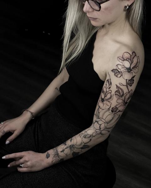 Fine line floral sleeve tattoo by @shoutone_