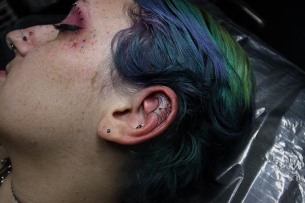 Fine Line spider web tattoo by @sidryantattoo