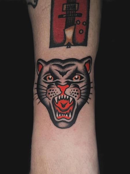 Traditional roaring panther tattoo by @siggytattoo