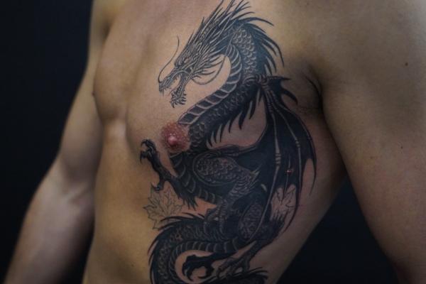 Blackwork dragon tattoo by @inkedsiren_tattoo