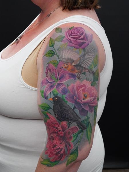 Realism bird and flowers tattoo by @inkedsiren_tattoo