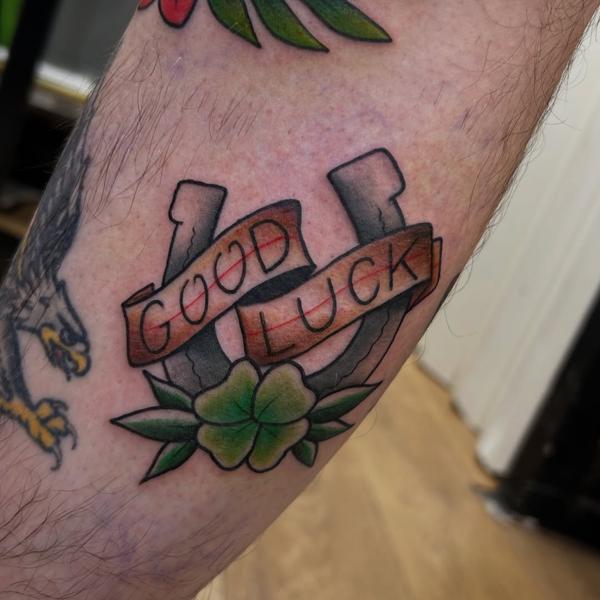Traditional horseshoe clover tattoo by @sjlant