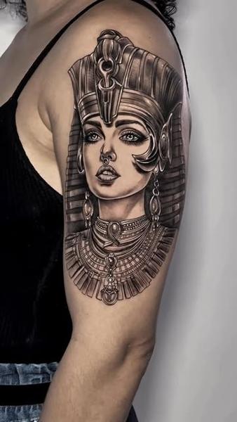 Realism egyptian queen tattoo by @slimmoxmooreblackwork