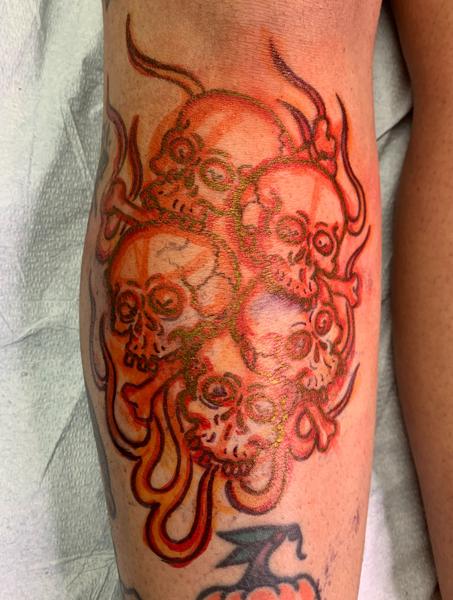 Traditional skull cluster tattoo by @smallpaultattoo