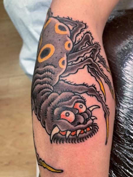 Traditional cartoon spider tattoo by @smallpaultattoo