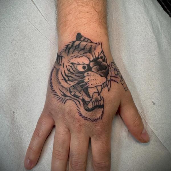 Traditional tiger head tattoo by @snowy_tattoo