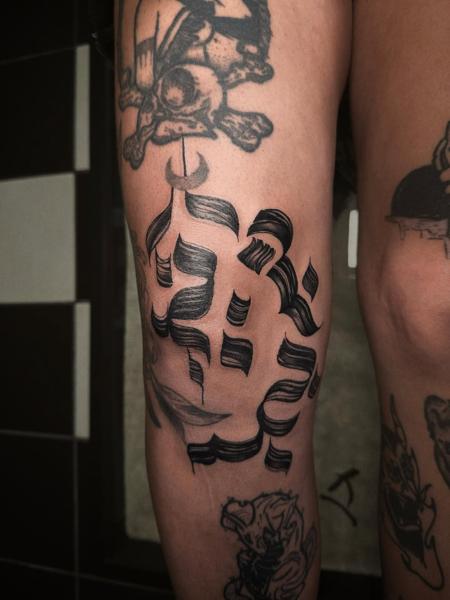 Blackwork ornamental script tattoo by @sofinatattoo