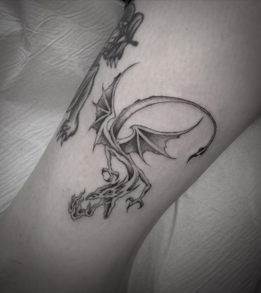 Blackwork fire-breathing dragon tattoo by @sonnyrohantattoo