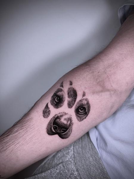 Realism dog paw print tattoo by @delavina.ttt