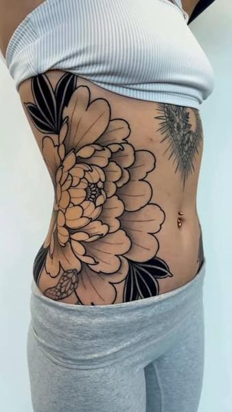 Blackwork floral design tattoo by @staceytattoos