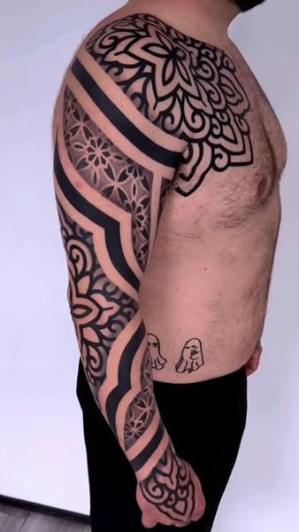 Blackwork geometric sleeve tattoo by @staceytattoos
