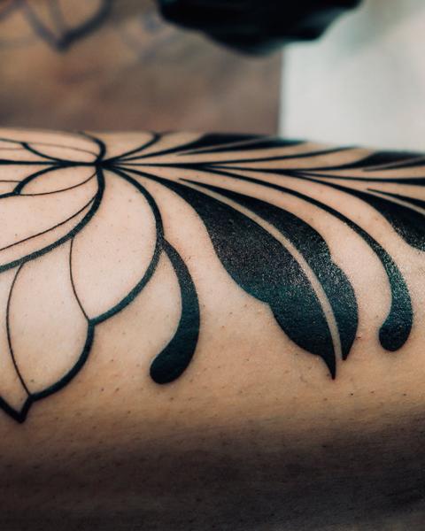 Blackwork geometric flower tattoo by @staceytattoos