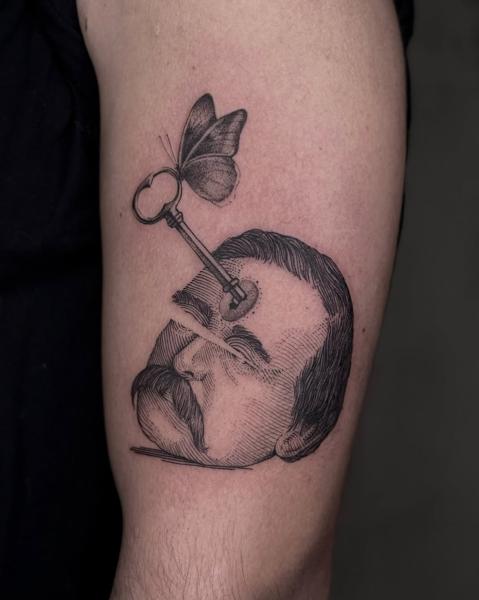 Illustrative key and butterfly tattoo by @_avlamis