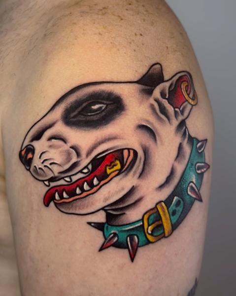 Traditional dog head tattoo by @stef_mits_tattoo