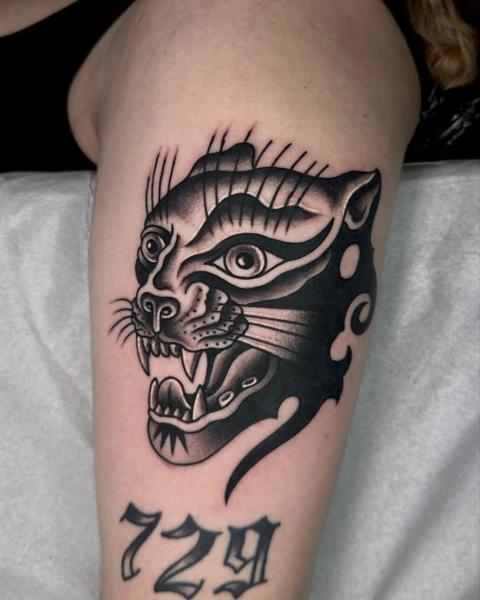 Traditional panther head tattoo by @stef_mits_tattoo