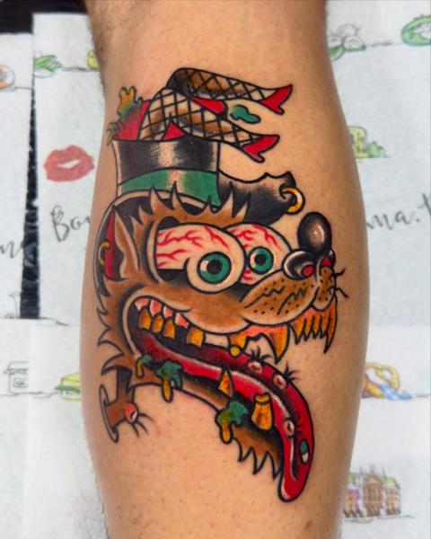 Traditional cartoon wolf tattoo by @stef_mits_tattoo
