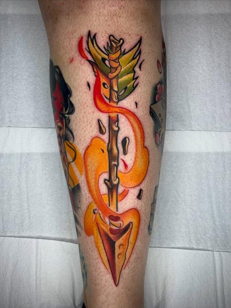 Neo-traditional fiery arrow tattoo by @stelios.linas