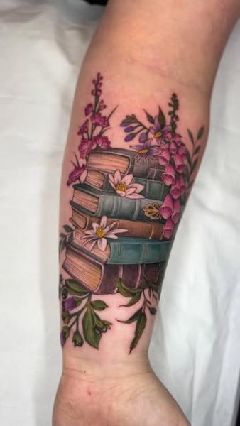 Illustrative floral books tattoo by @stephanie_melbourne