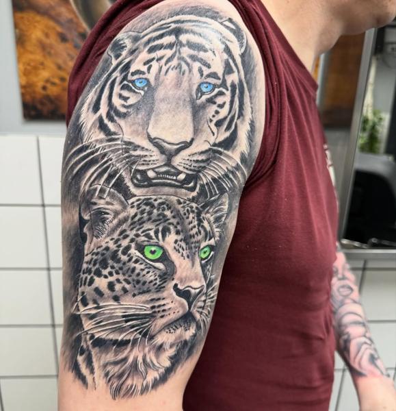 Realism tiger and leopard tattoo by @tattoozbysteve