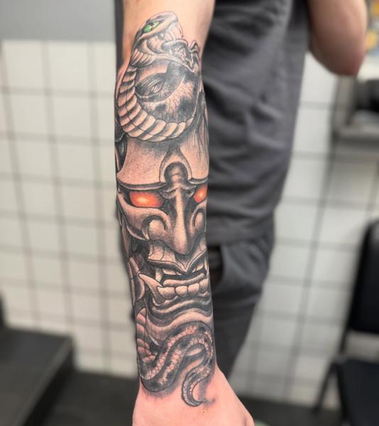Realism snake and mask tattoo by @tattoozbysteve