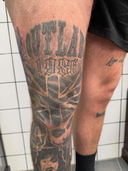 Blackwork outlaw lettering tattoo by @tattoozbysteve
