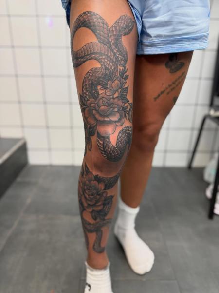Blackwork floral snake tattoo by @tattoozbysteve