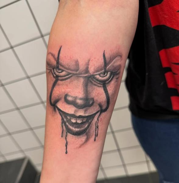 Realism creepy clown tattoo by @tattoozbysteve