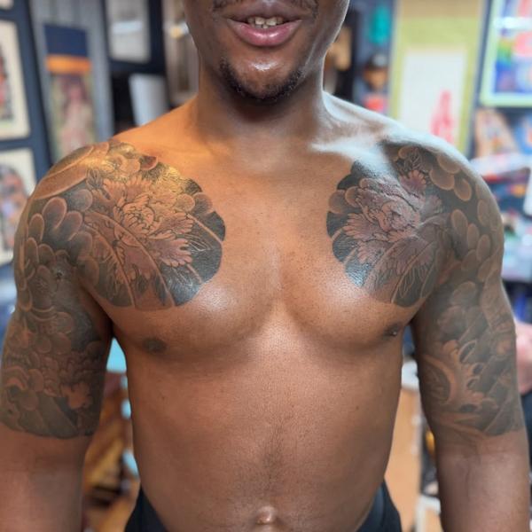 Japanese floral chest piece tattoo by @stewart_modernclassic