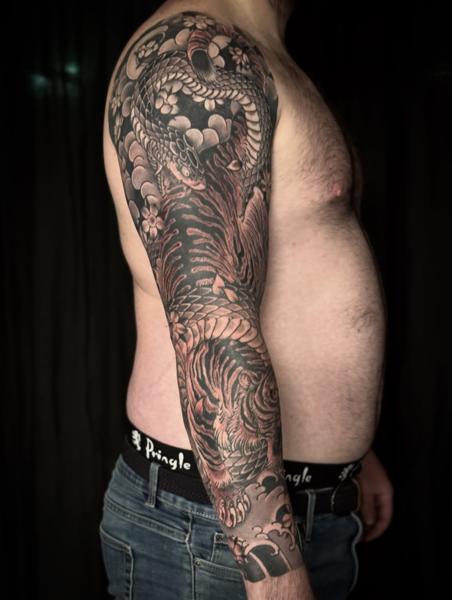 Japanese snake and tiger tattoo by @stewart_modernclassic