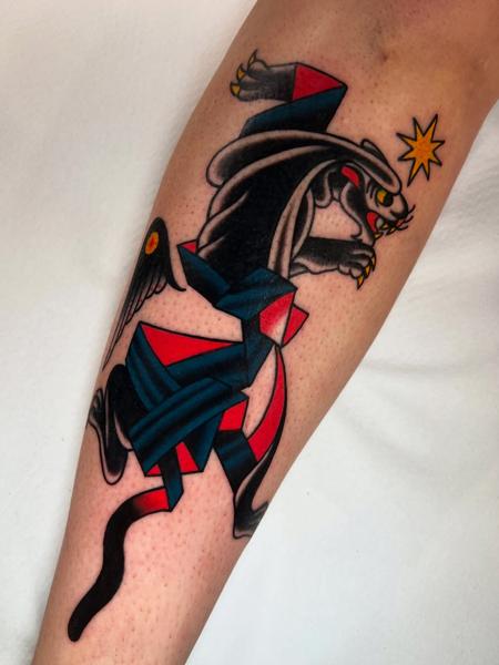 Traditional geometric panther tattoo by @stoyjunx