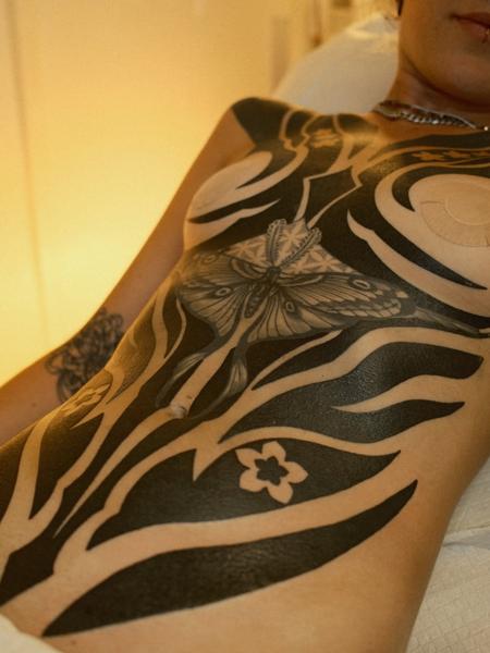 Blackwork moth and patterns tattoo by @si_tattoos