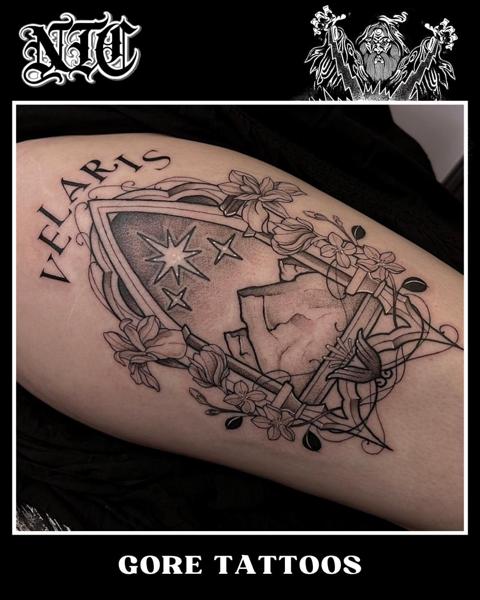 Blackwork floral shield tattoo by @goretattoos
