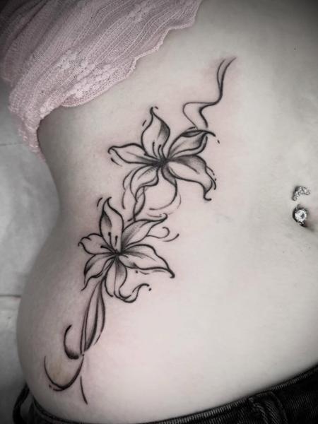 Blackwork floral lilies tattoo by @tattooinestudios