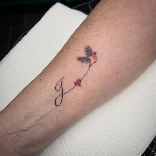 Fine line bird and heart tattoo by @tattoosbycay
