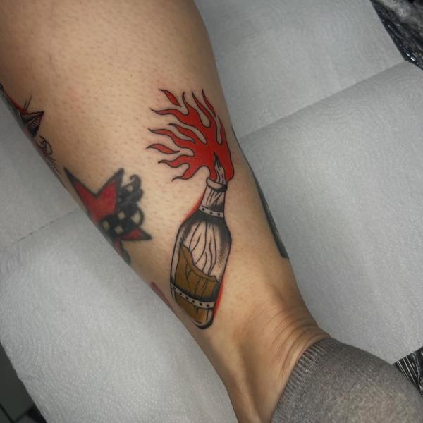 Traditional molotov cocktail tattoo by @tattoosbynunes