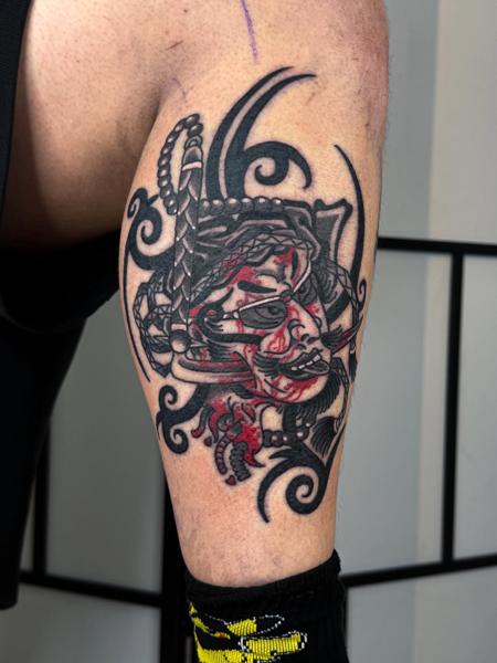 Japanese oni mask tattoo by @wastedyouth.tattooer