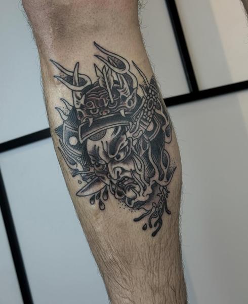 Japanese oni mask tattoo by @wastedyouth.tattooer