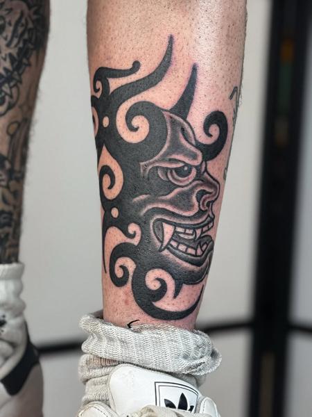 Japanese oni mask tattoo by @wastedyouth.tattooer