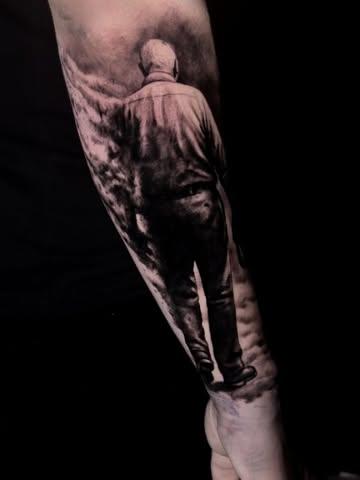 Realism walking man tattoo by @thanos_stokas_tattoo