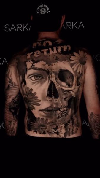 Realism floral skull tattoo by @thanos_stokas_tattoo