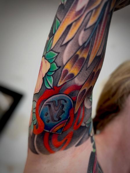 Traditional helmet and flames tattoo by @the27life