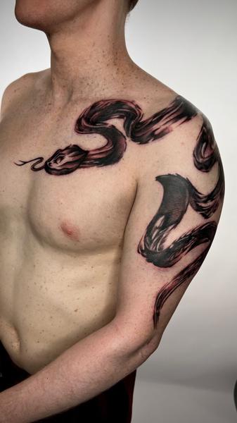 Blackwork brushstroke snake tattoo by @the27life